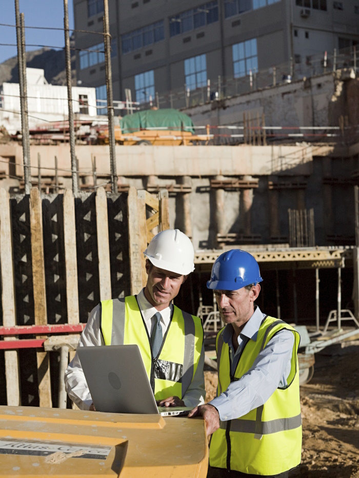 Photo of men on a construction site. 