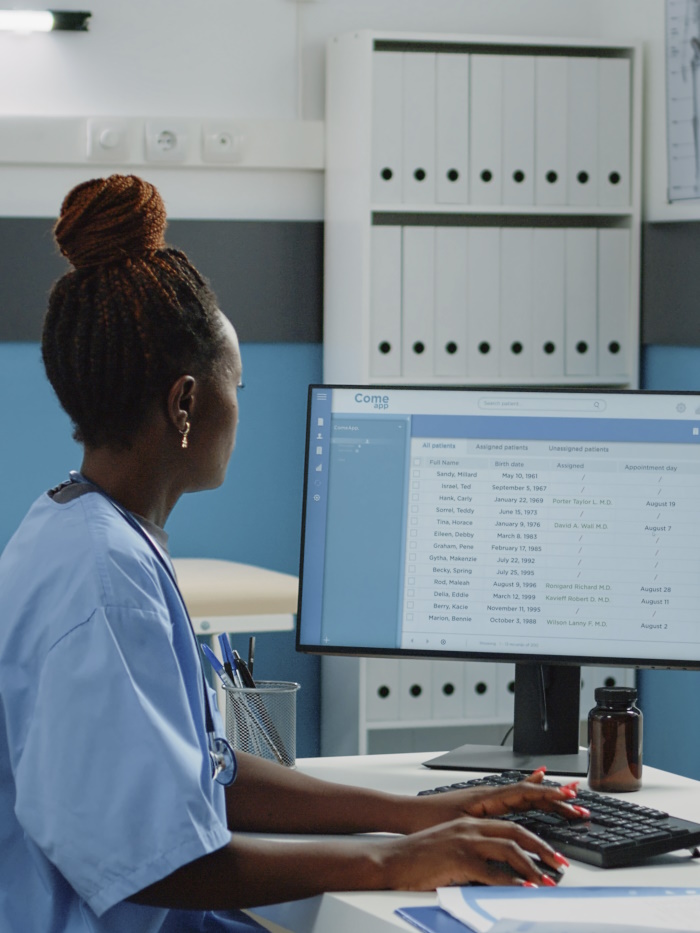 Photo of Healthcare worker using a computer.